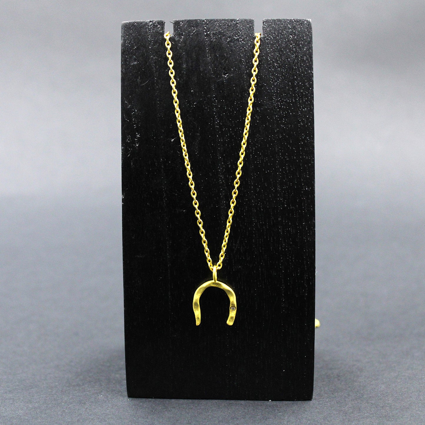 Button earring with 18kt gold plated chain