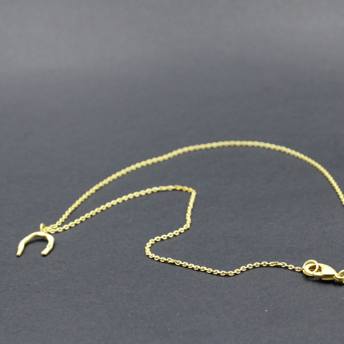 Button earring with 18kt gold plated chain