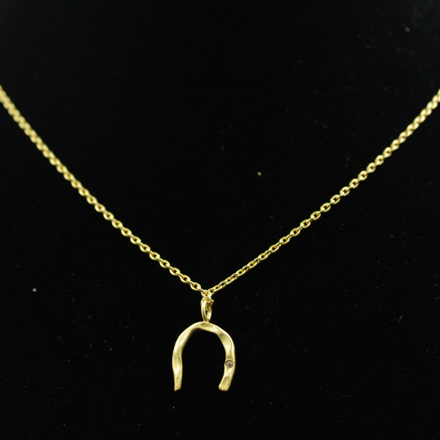 Button earring with 18kt gold plated chain